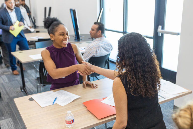 A young woman meets a career counselor at a San Antonio event